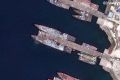 Последствия прилетов дронов ВСУ в район пусковых установок крылатых ракет «Калибр» фрегатов «Адмирал Эссен» и «Адмирал Макаров» проекта 11356Р в бухте Новороссийска, снятые спутниками американской компании Vantor